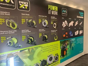 LED lighting product display wall with downlights, ambient and industrial signage