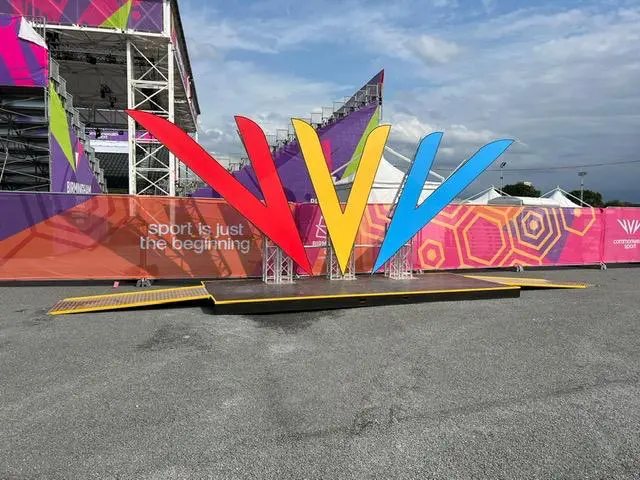 Commonwealth Games backdrop and staging area with large signage